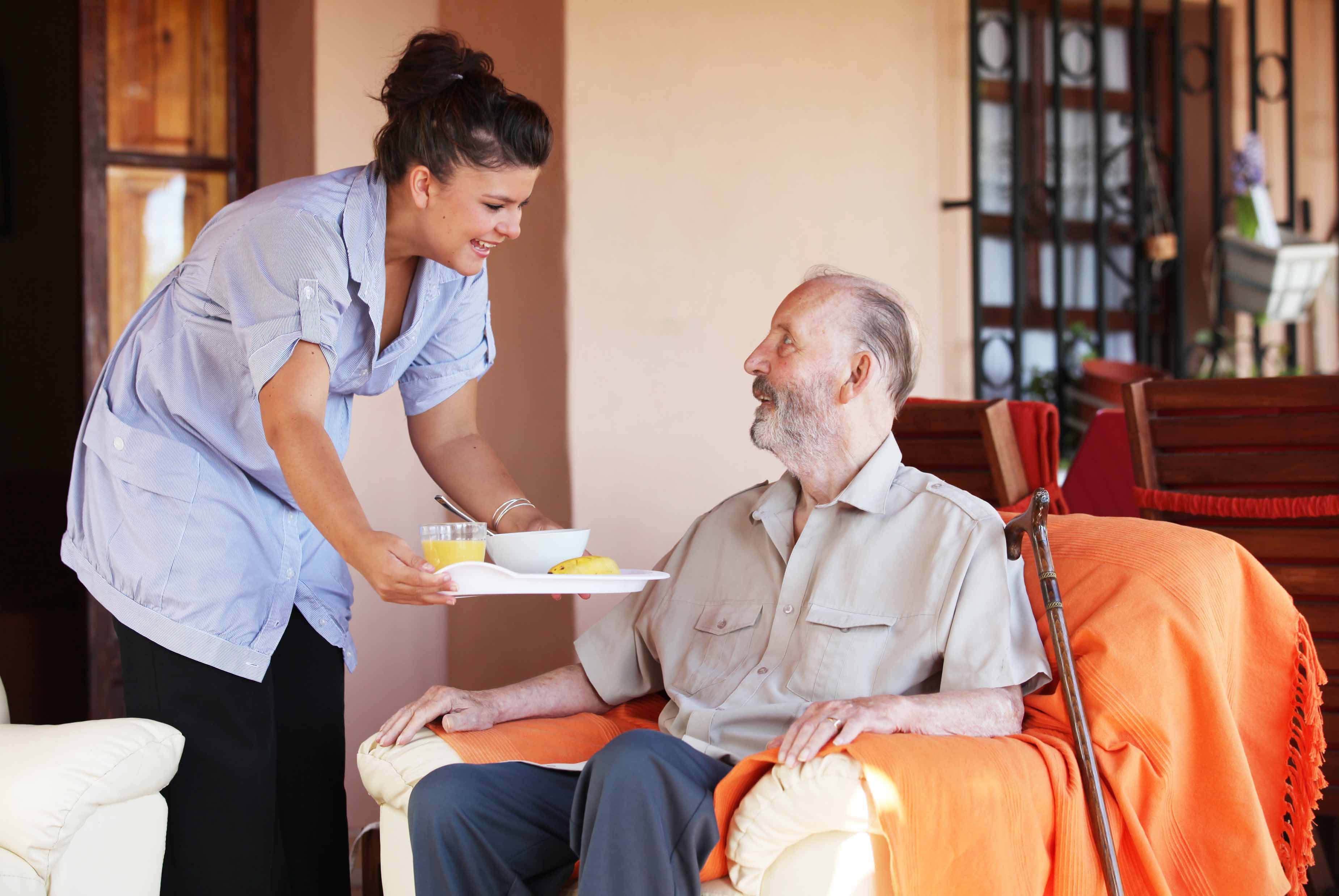 A Stockwellcare carer sharing a warm moment with a service user